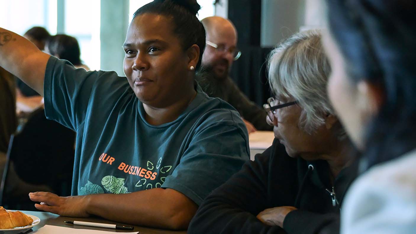 A women raising her arm participating in a consultation