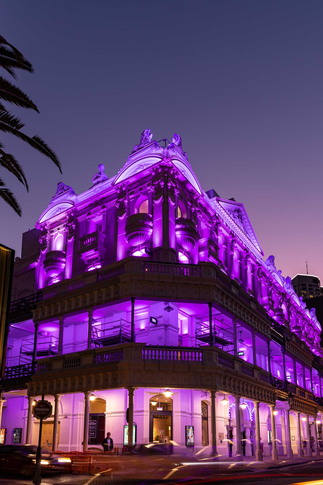 His Majesty's Theatre lit in purple lighting at night