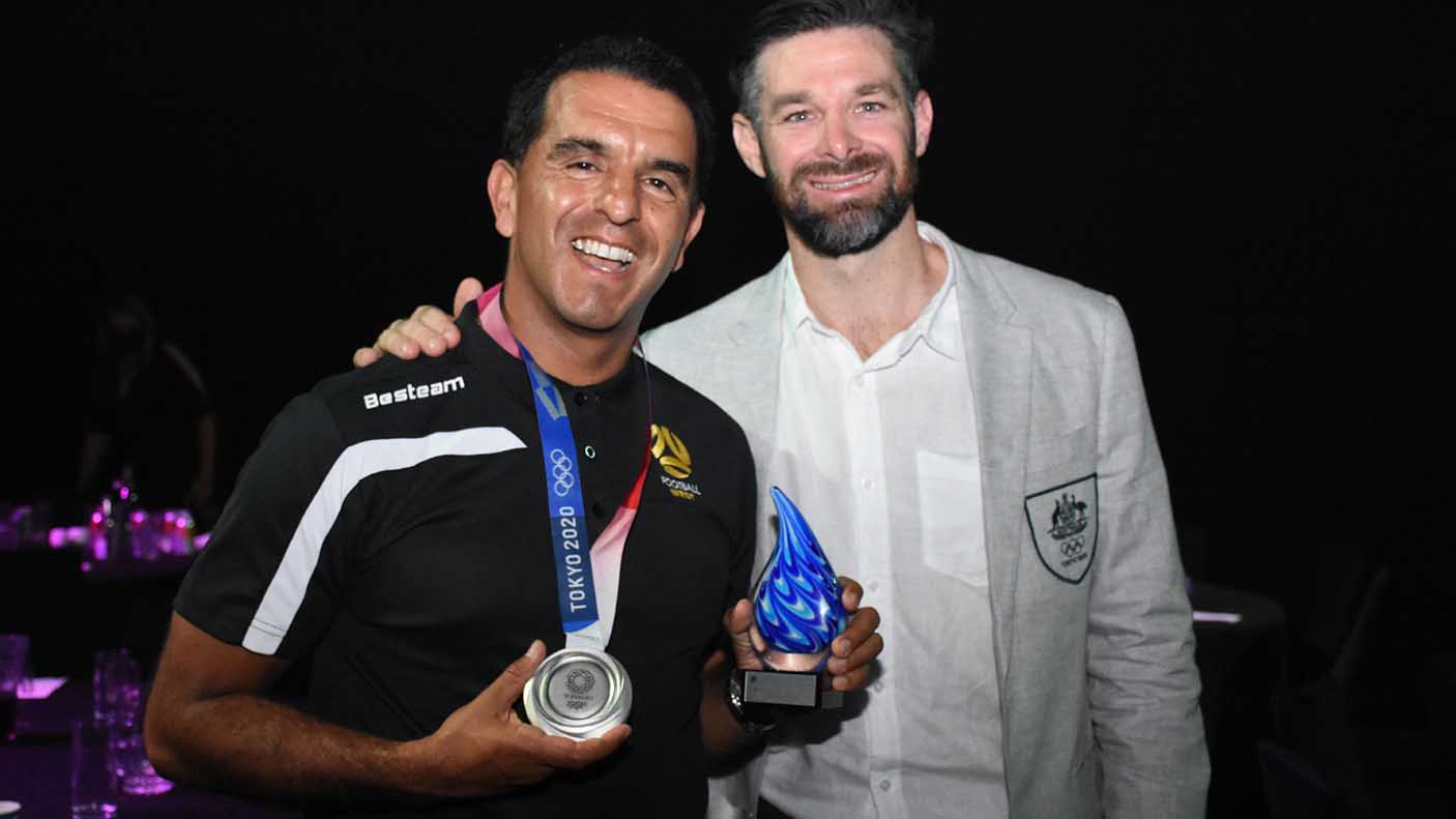 Juan Propato holding his trophy with Trent Mitton